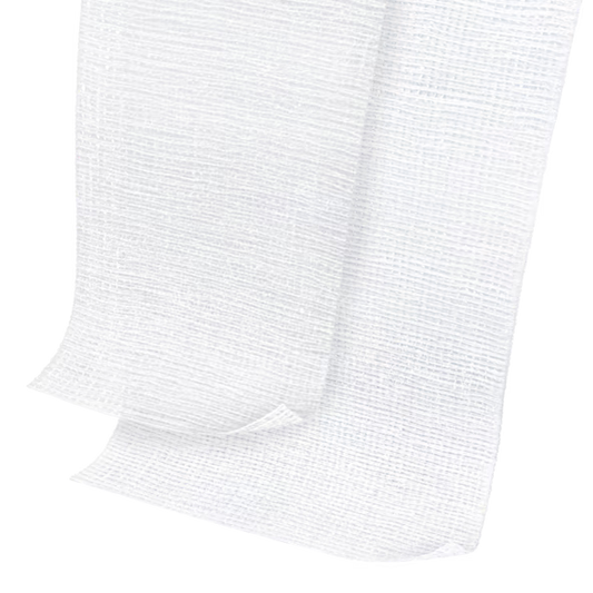 White gauze bandage or medical dressing material shown folded on a plain white background.